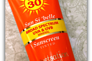 Sun Si'belle Broad Spectrum UVA & UVB Tinted Sunscreen Tilted Front Label
